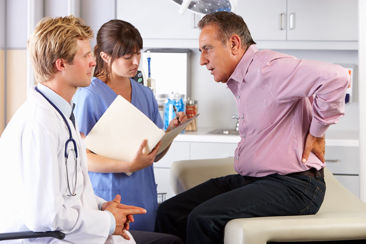man visiting doctor for back pain